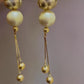 White cotton Pearl earrings with gold color frame